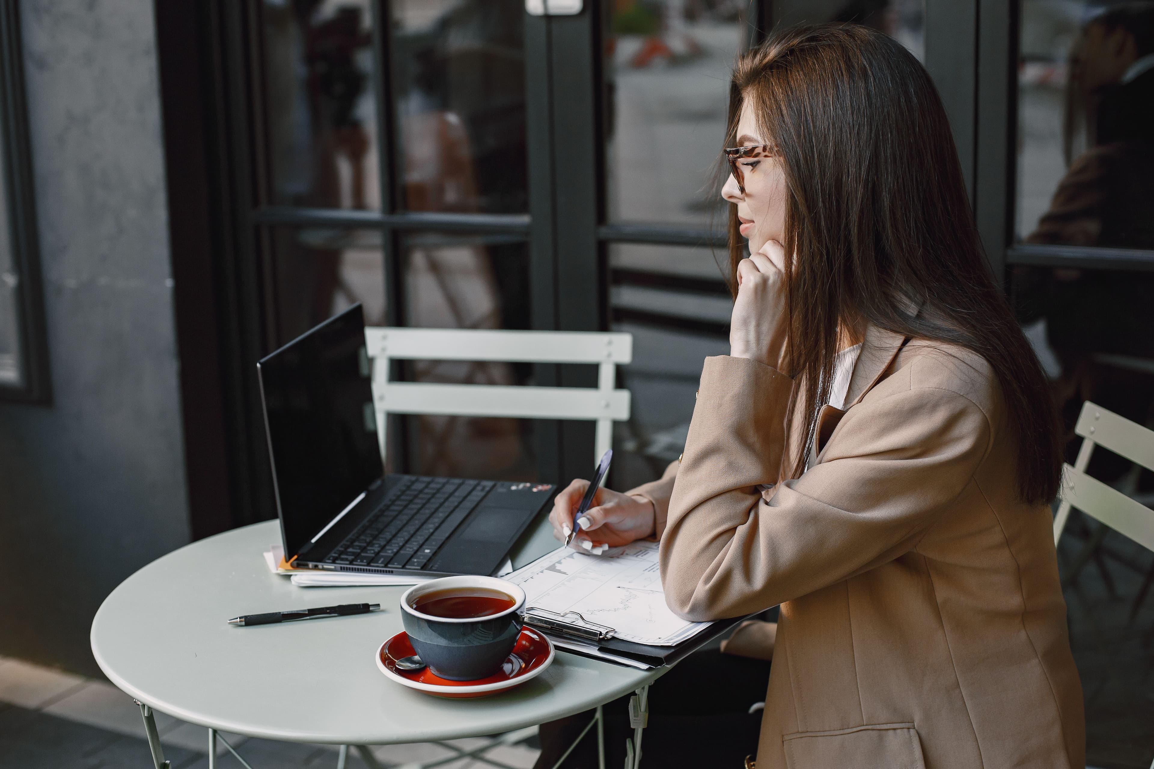 Business professional thinking at a café